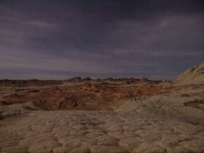 White Pocket sandstone formations in moonlight