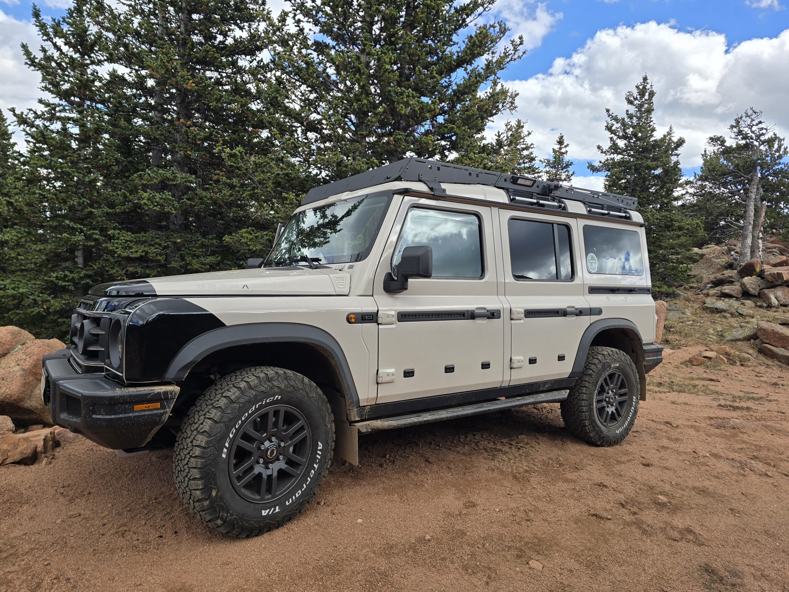 INEOS Grenadier parked on a mountain trail