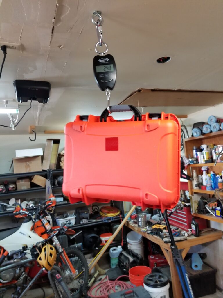 Weighing a dry box for the Paddling Down canoe expedition